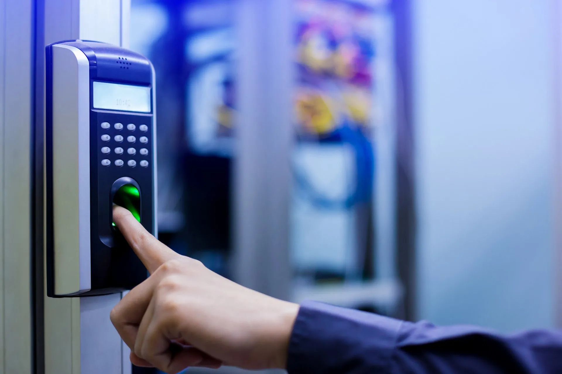 Technician performing maintenance on a commercial access control system